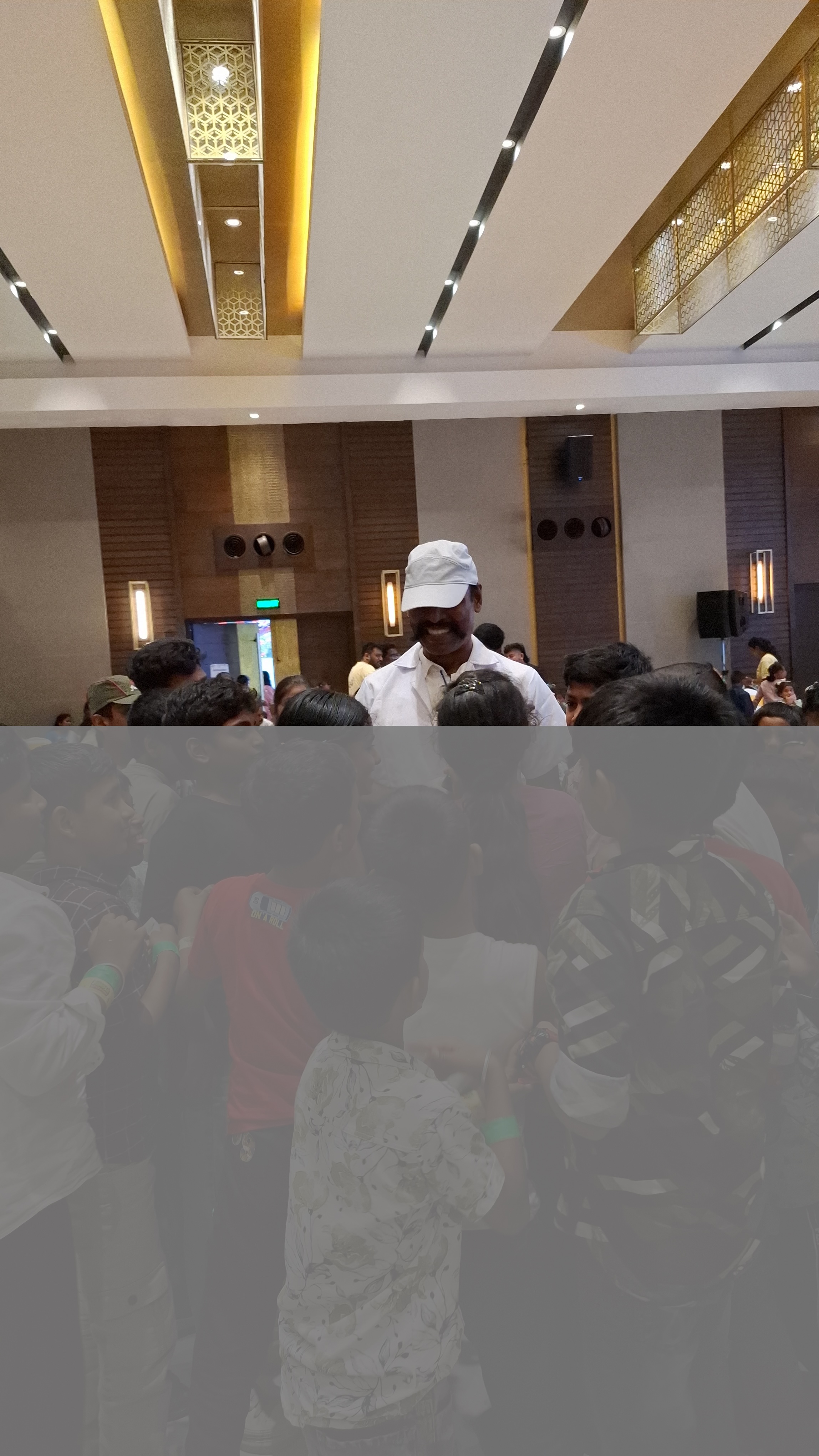 Sami interacting with children at Ezone corporate science event 2026